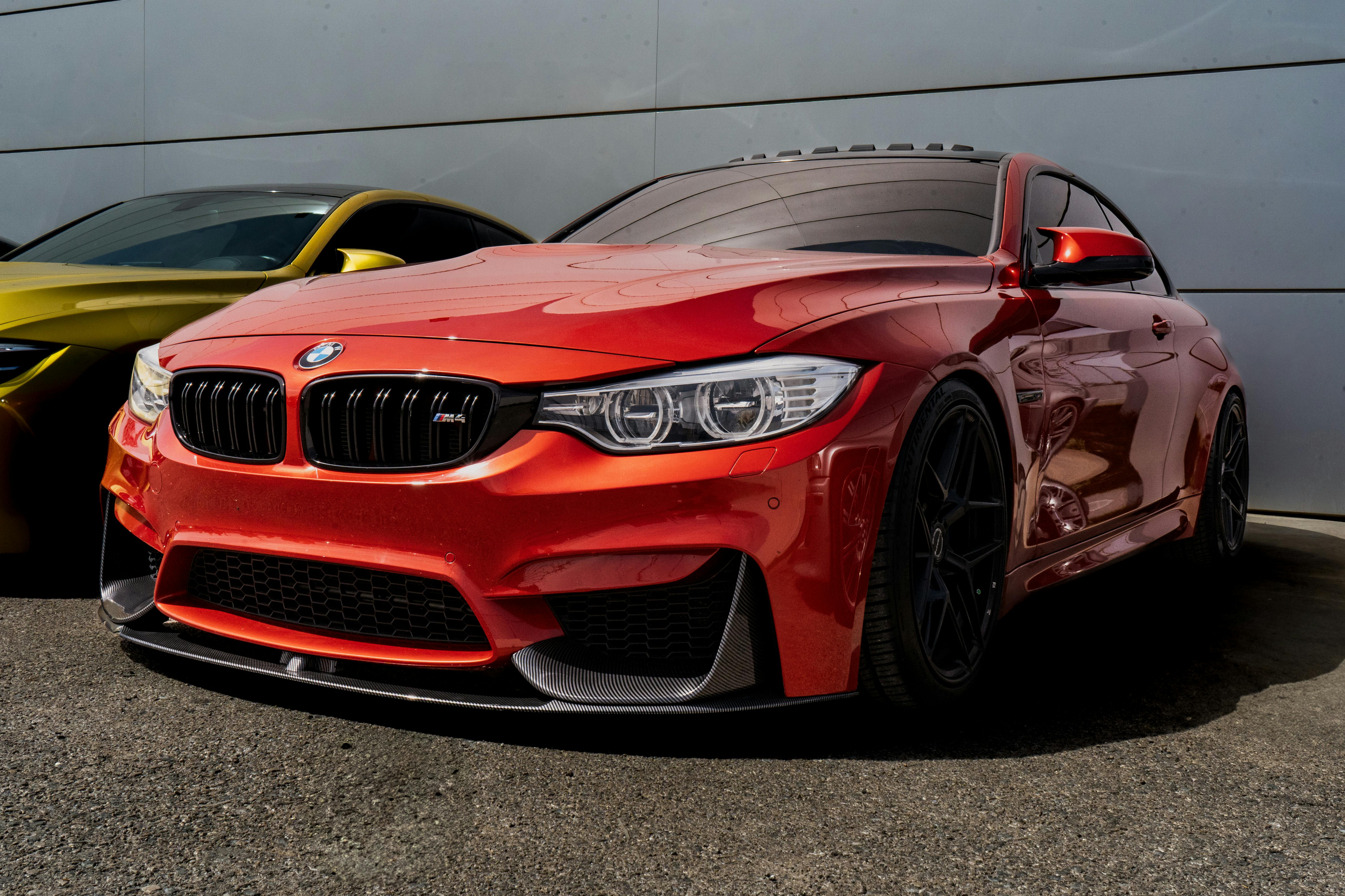 Vibrant red sports car parked outdoors, showcasing sleek design and modern style.